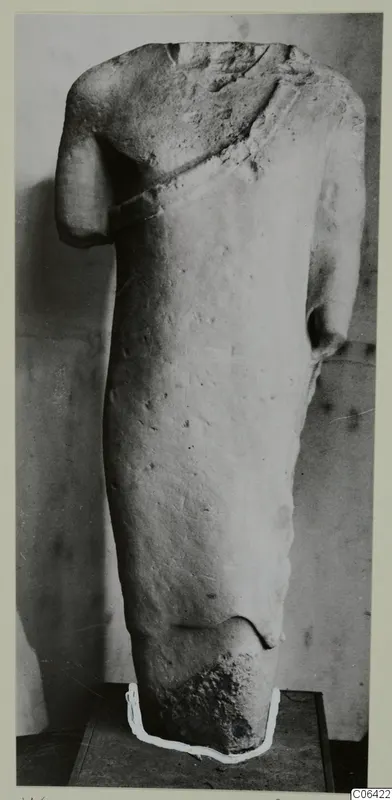 Limestone sculpture torso from Vouni, head and lower body broken off, shown on a dark base