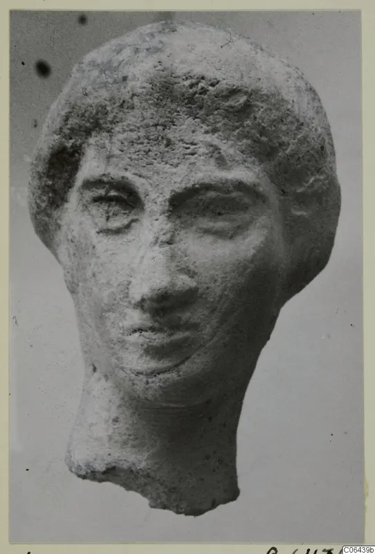Terracotta head sculpture from Vouni with a broken neck, shown from the front