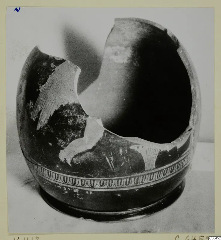 Broken pottery vessel with a band of looped pattern around the lower body, from Vouni