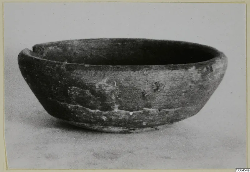 Side view of a coarse ware bowl with a notch broken from its rim, from Vouni