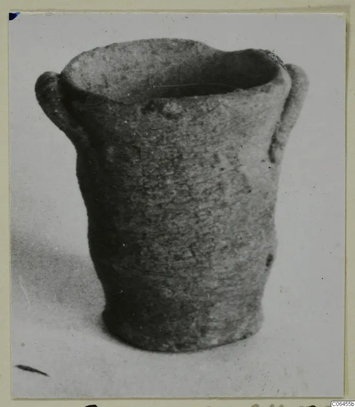 Miniature Plain White VI pottery vessel with two handles, from Vouni