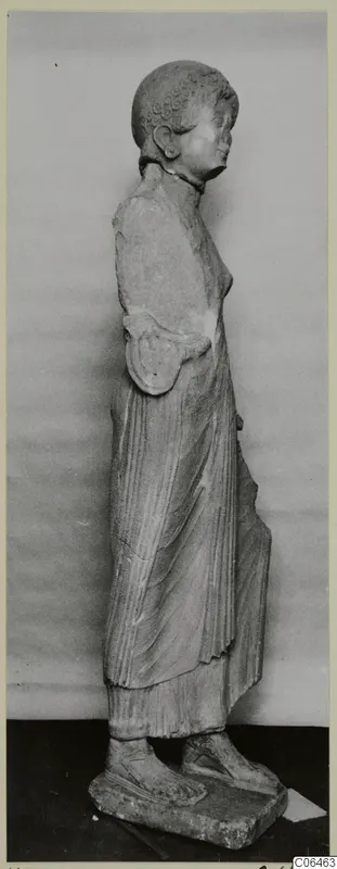 Limestone statue of a standing woman, seen in profile, from Vouni