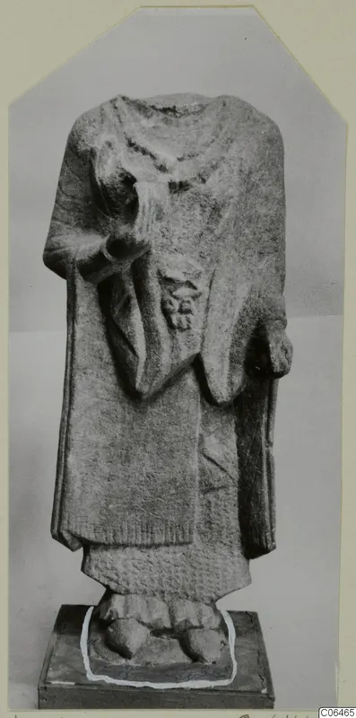 Headless limestone statue of a standing figure in a long garment, from Vouni