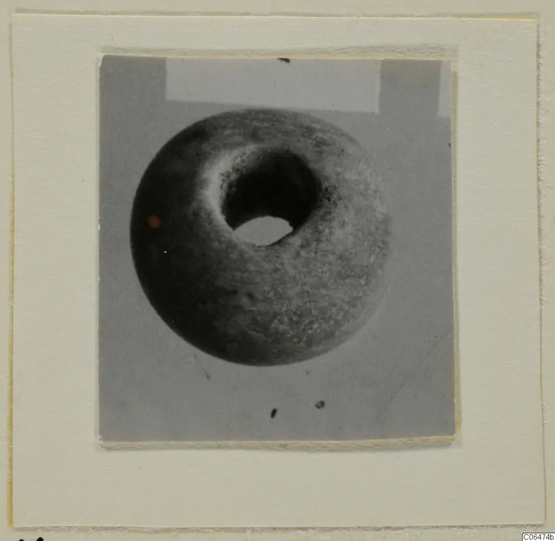 Bone bead with a large central hole, from Kition