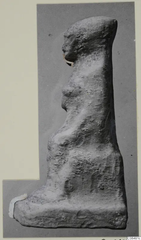 Terracotta figurine in profile facing left, standing on a flat base, from Vouni