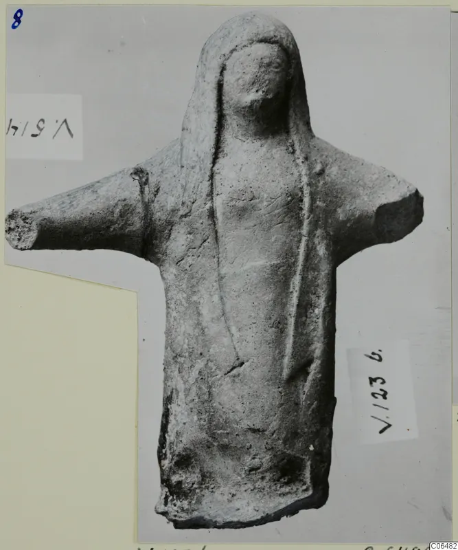 Terracotta figurine of a standing figure with arms stretched out to the sides, from Vouni