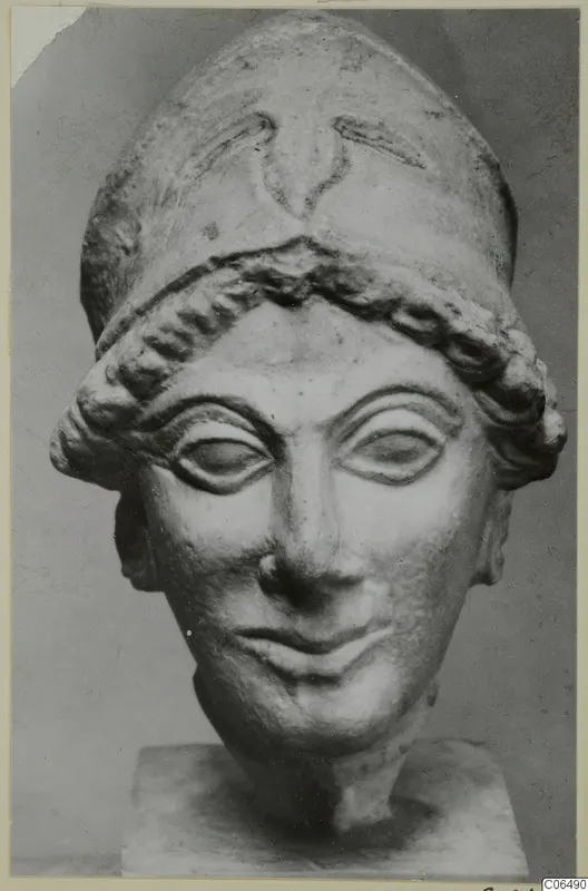 Limestone head of a figure wearing a tall cap, from Vouni