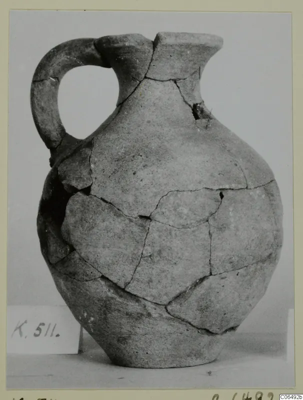 Pottery Plain White VII jug from Kition, reconstructed from joined sherds, with a strap handle