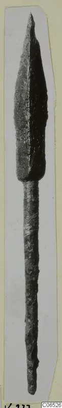 Bronze weapon point with long shank, from Vouni, shown upright on a card mount