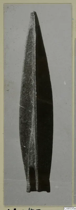 Long pointed blade with a raised central ridge and a short squared base, arrowhead find from Vouni