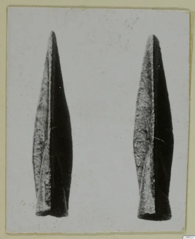 Two metal weapon blades, long and pointed, from Vouni, photographed side by side