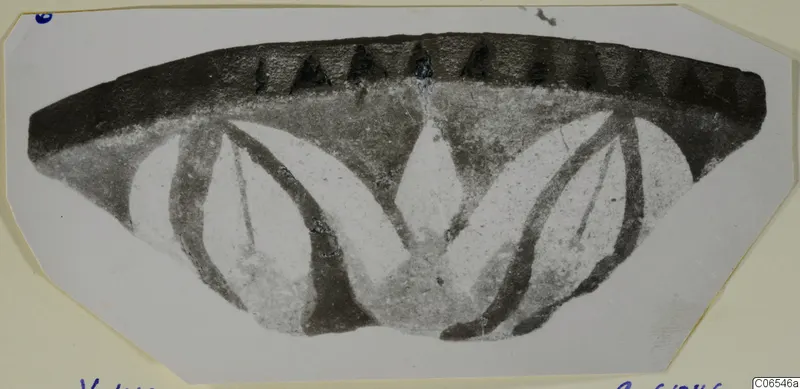 Fragment of a bowl at Vouni with a dark rim band and pale pointed leaves below