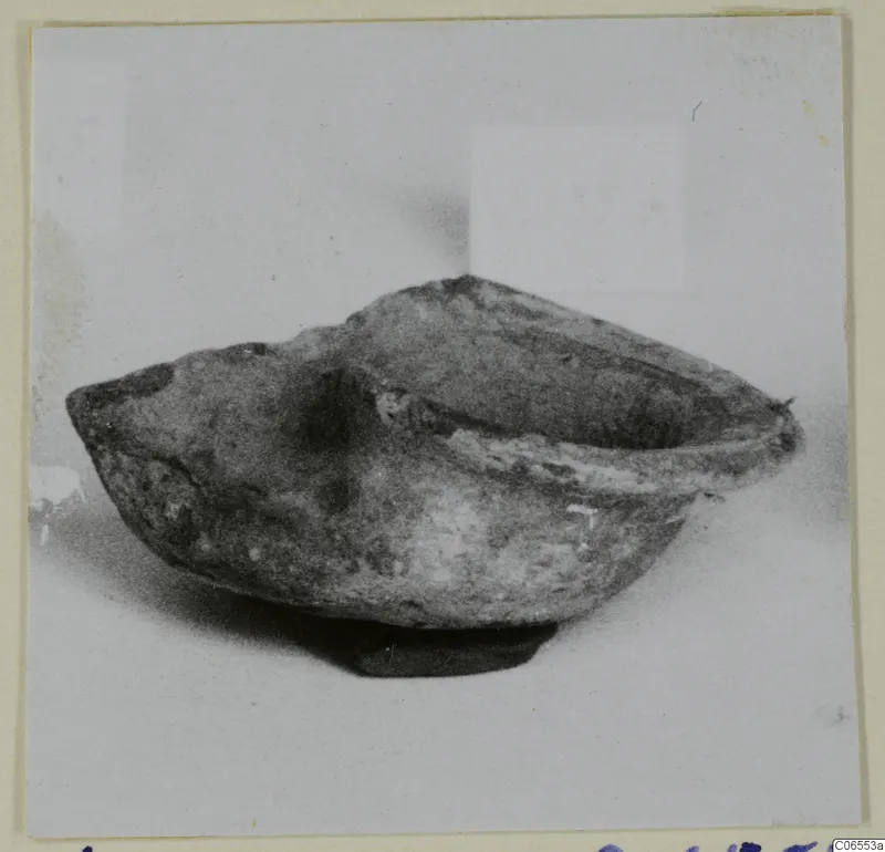 Terracotta lamp from Vouni with an open bowl-shaped body and a spout to the left
