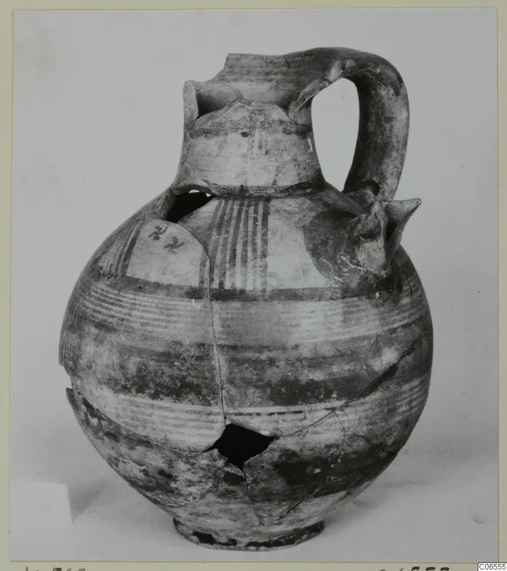 Jug of Pottery Bichrome III from Kition, with painted horizontal bands and vertical stripes on the body