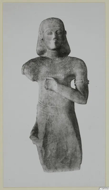 Limestone Neo-Cypriote standing figure with one hand raised to the chest, seen from the front