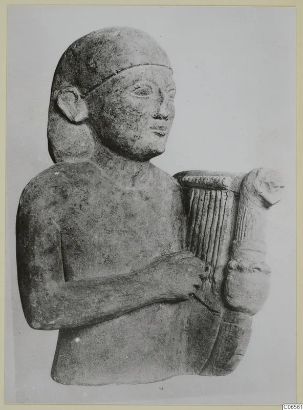 Limestone Cypro-Egyptian sculpture of a man holding a lyre-shaped stringed instrument, three-quarter view.
