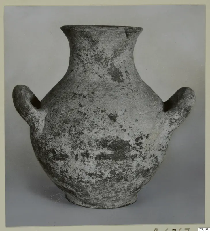 Plain white amphoriskos with a narrow flaring neck and two rounded handles, shown against a grey backdrop.
