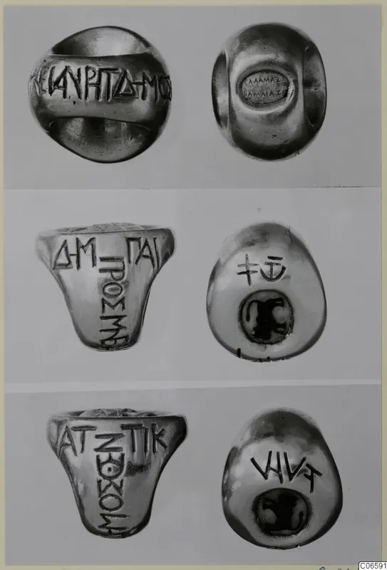 Three rings, each shown in two views, with lettering on the hoops and engraved or set bezels