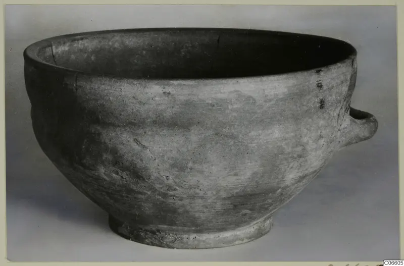 Plain White bowl with a small horizontal handle, from Vouni