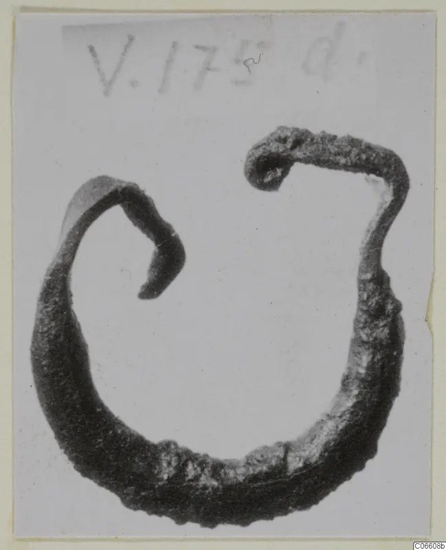 Corroded bronze staple-shaped fragment with two hooked ends, from Vouni