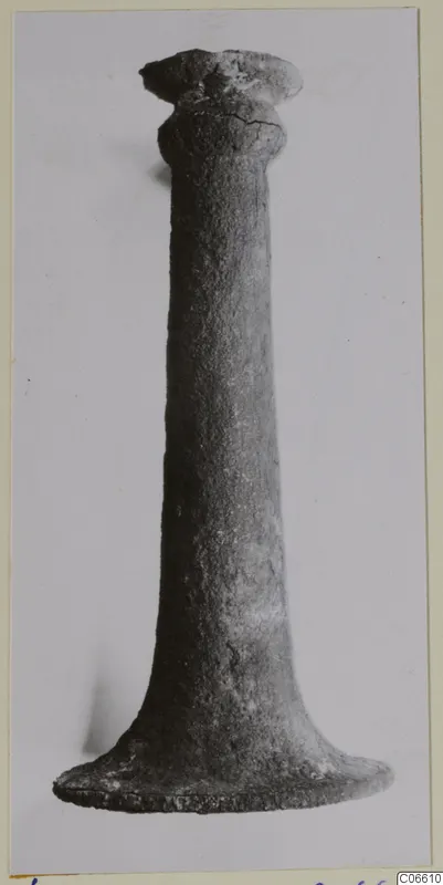 Bronze incense-burner from Vouni: a tall, corroded metal stand with a flared foot and a cup-shaped top.