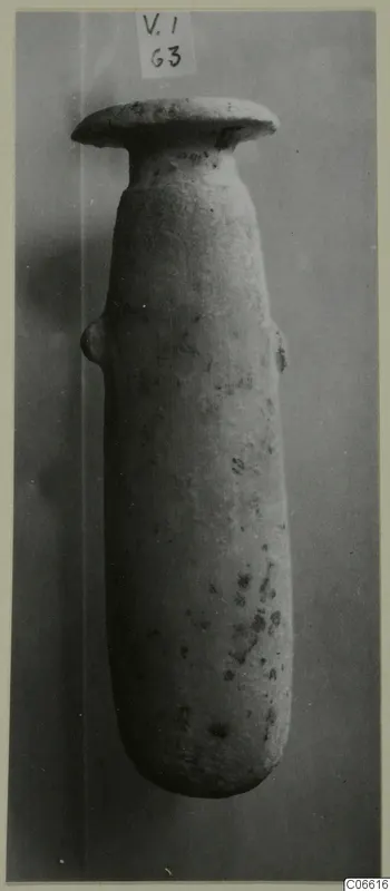 Tall stone vessel with a flat disc-shaped rim and a small side handle, from Vouni
