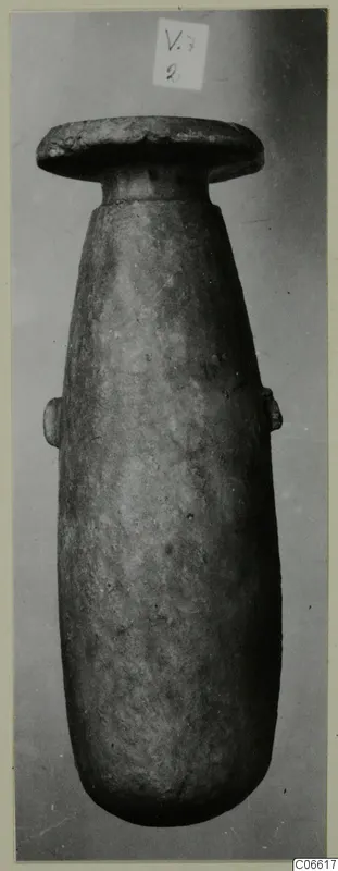 Alabaster vase from Vouni, Korakas tombs, with a flat disc-shaped rim and two small lugs on the body