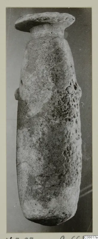 Alabaster vessel from Vouni, with a flat disc-shaped rim on a short neck and a rounded body.