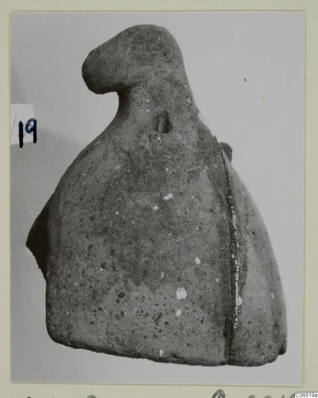 Bell-shaped find from Vouni T. 1-16, photographed on a mounted card with a number label