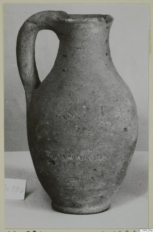 Pottery Plain White VII jug with a single loop handle and a narrow ring foot