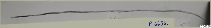 Long thin pin from Vouni, lying almost horizontally on a pale grey background