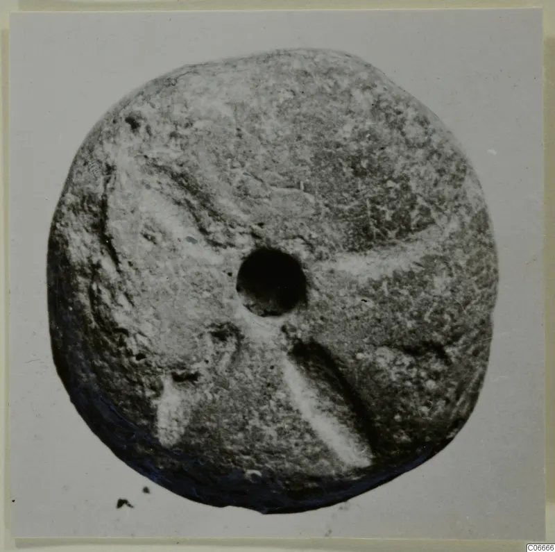 Terracotta disc with a central hole, from Soli
