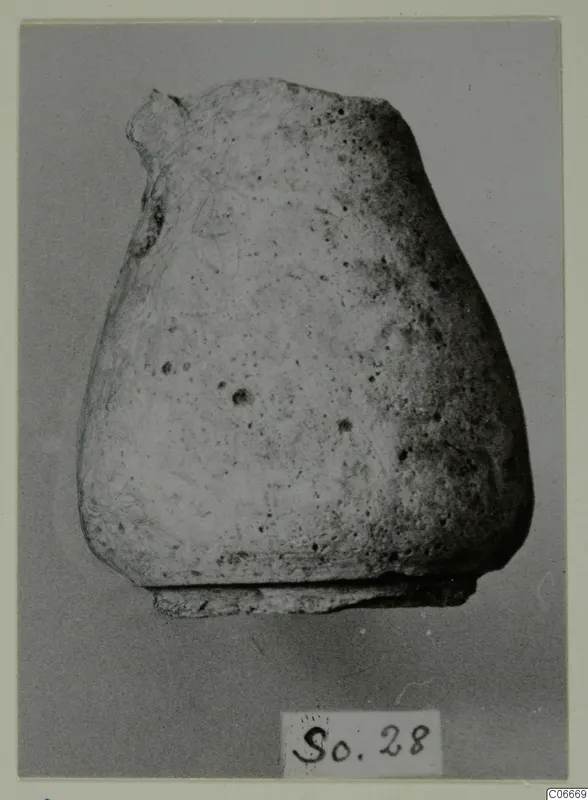 Hellenistic Wares juglet: a pottery vessel with a rounded body and broken neck, with a number label