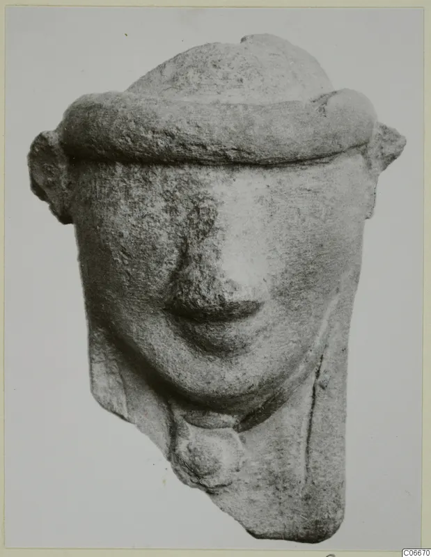 Terracotta Minor Plastic 2: figurine head with a thick rounded band across the top and protruding ears