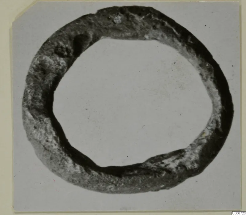 Lead ring, So.35, photographed on a plain card mount.