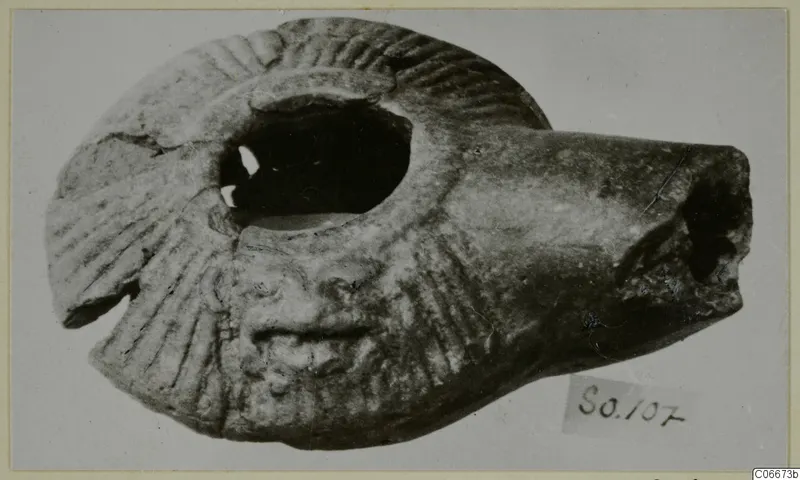Terracotta lamp with radiating grooves on its shoulder, from Soli