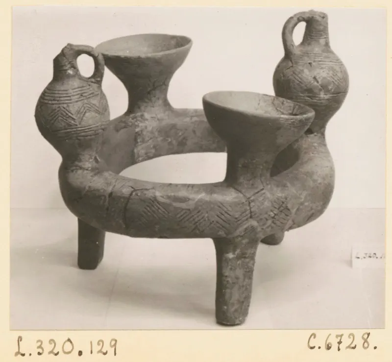Ring-vase from Lapithos with two bowl-shaped cups and two jugs with loop handles on a ring-shaped body
