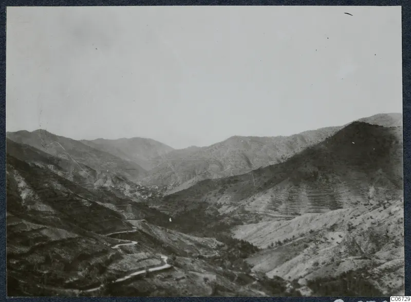 Landscape view of a valley with terraced hillsides and a winding road, at Lapithos