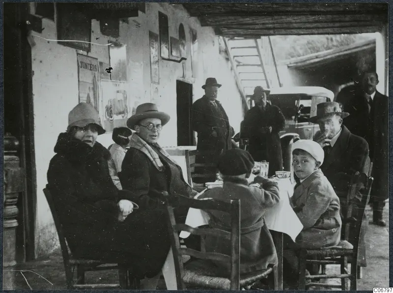 Group at a table under a covered porch, lunch break in the village of Skarinou, Larnaca district