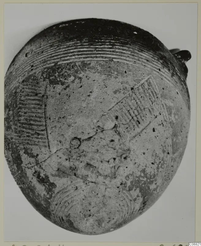 Pottery vessel from the Vrysi tou Barba tombs at Lapithos, with grooved and incised decoration on its body.
