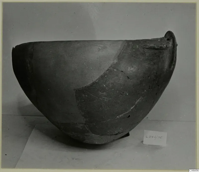 Red Polished II bowl with a small handle-like lug at the rim, shown on a plain surface with a number label.