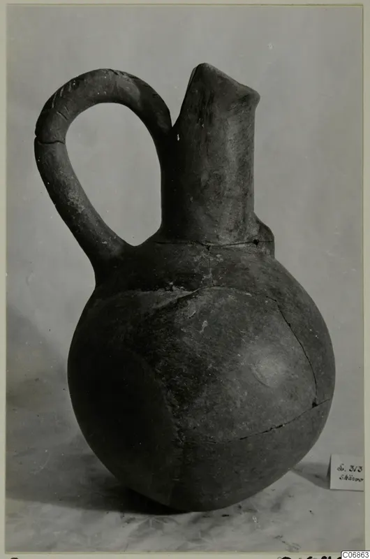 Red Polished III jug with a single loop handle and tall neck, from Lapithos