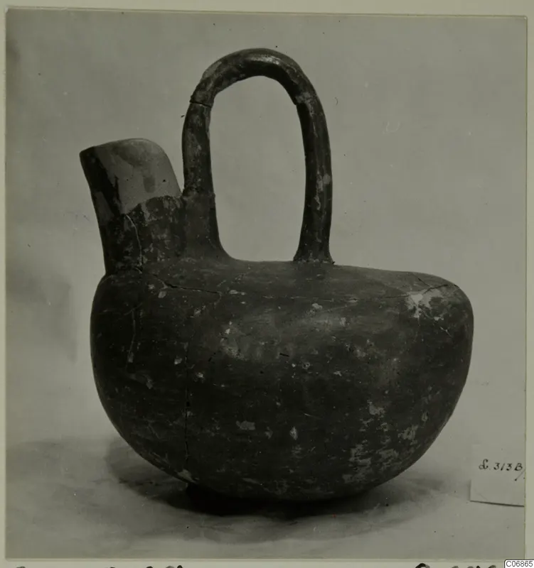 Red Polished III jug from Lapithos, with a tall loop handle and a short side spout