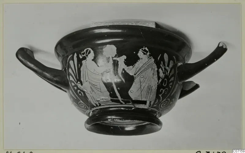 Red figured skyphos, a two-handled cup, with painted draped figures between palmette ornaments