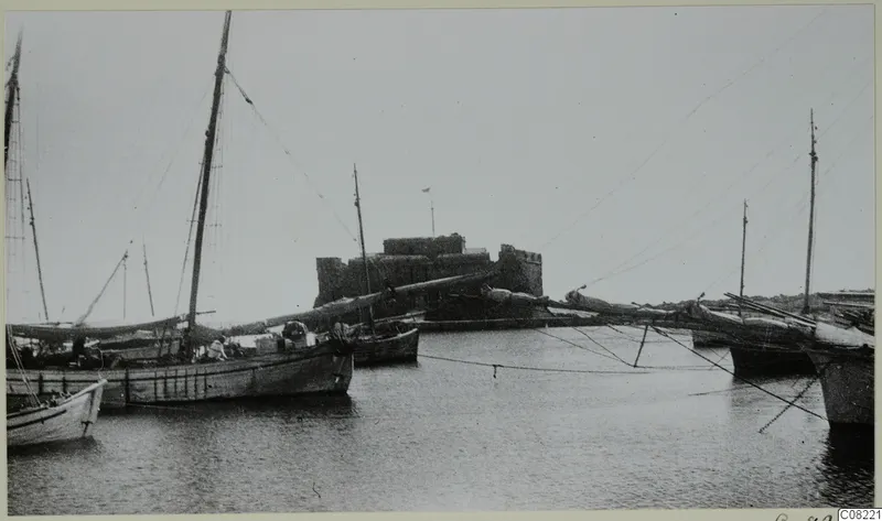 Paphos Castle at the western end of the city port, with moored sailing boats in the foreground