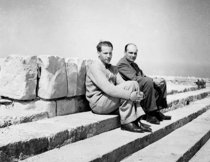 Alfred Westholm and Knut Thyberg seated on stone steps at Vouni, beside large cut stone blocks