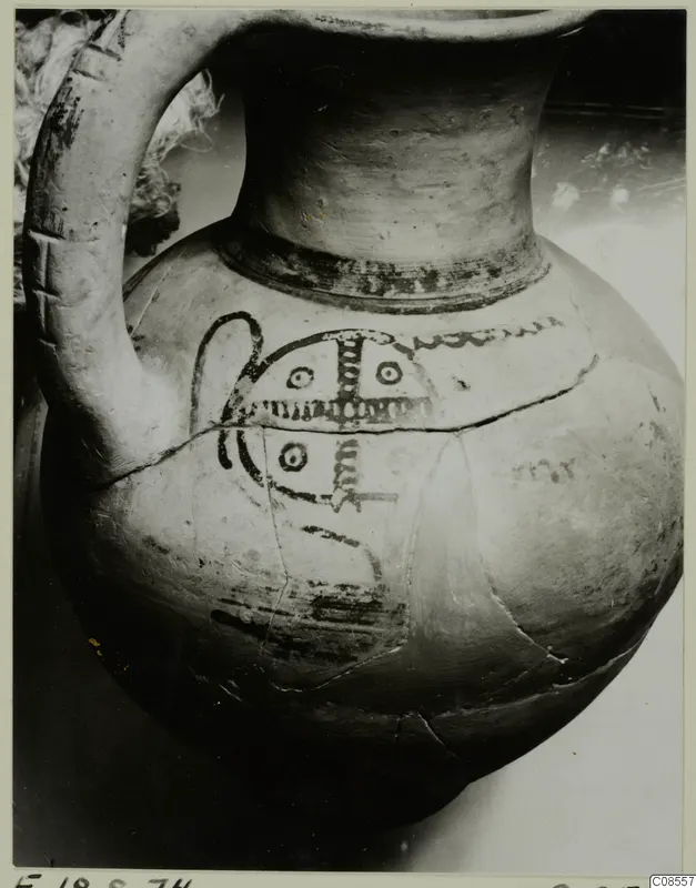 Bowl-jar of Levanto-Helladic Ware with a loop handle and dark painted motifs on its round body