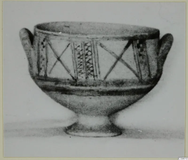 White Painted II bowl with two handles, decorated with crossed lines and vertical hatched panels, from Amathus.
