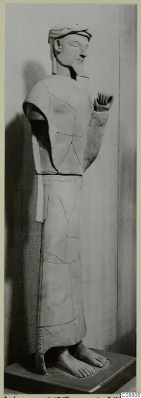 Terracotta statue of a bearded standing figure from Ayia Irini, shown in profile and mended from broken pieces