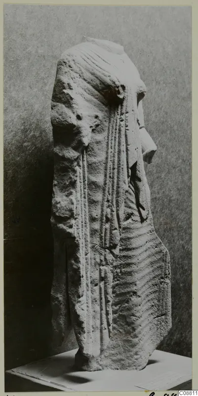 Limestone figure from Vouni in side view, with grooved hair and a projecting nose